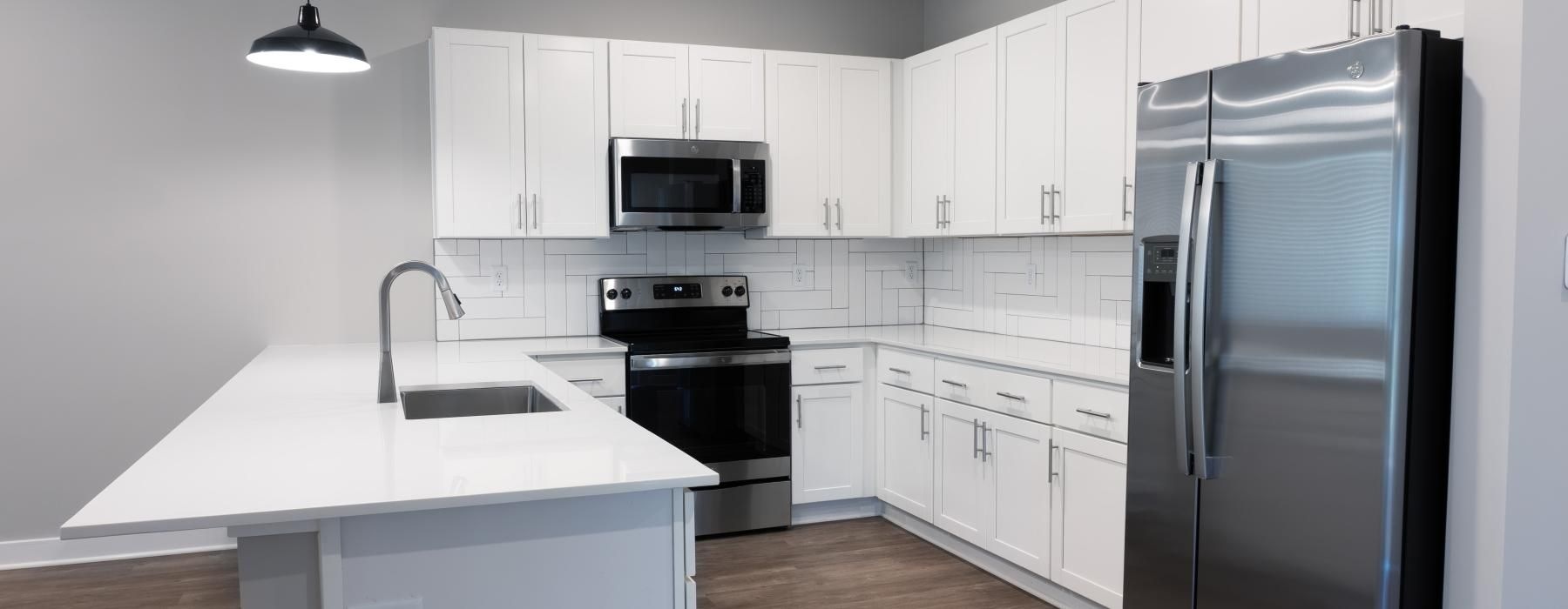 a kitchen with white cabinets