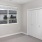 a room with a window and a closet