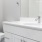 a bathroom with a sink toilet and mirror