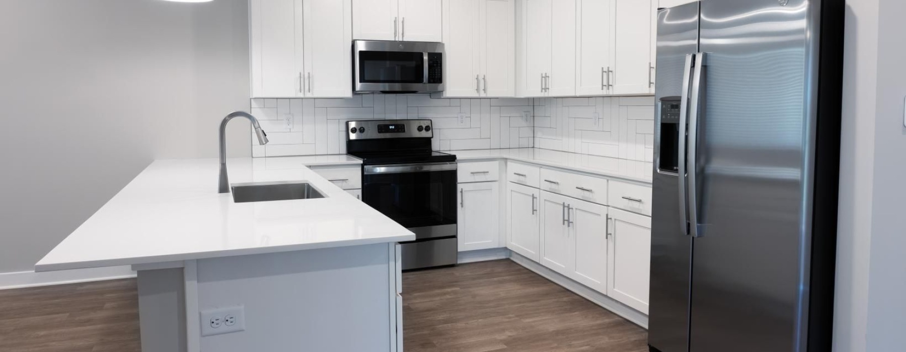 a kitchen with white cabinets