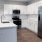 a kitchen with white cabinets