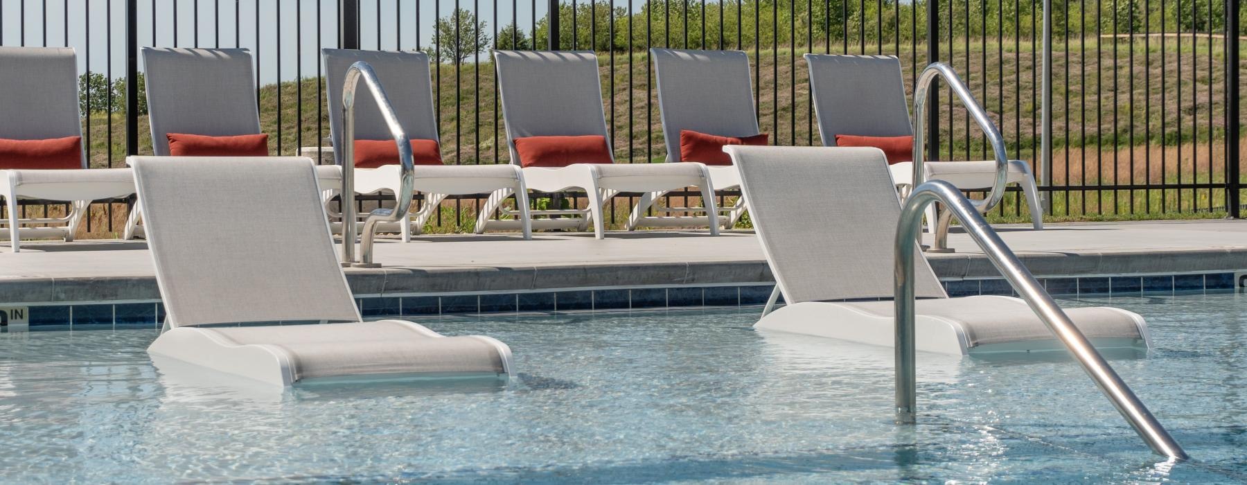 a pool with chairs around it