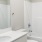 a bathroom with a tub sink and toilet