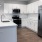 a kitchen with white cabinets