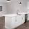 a kitchen with white cabinets