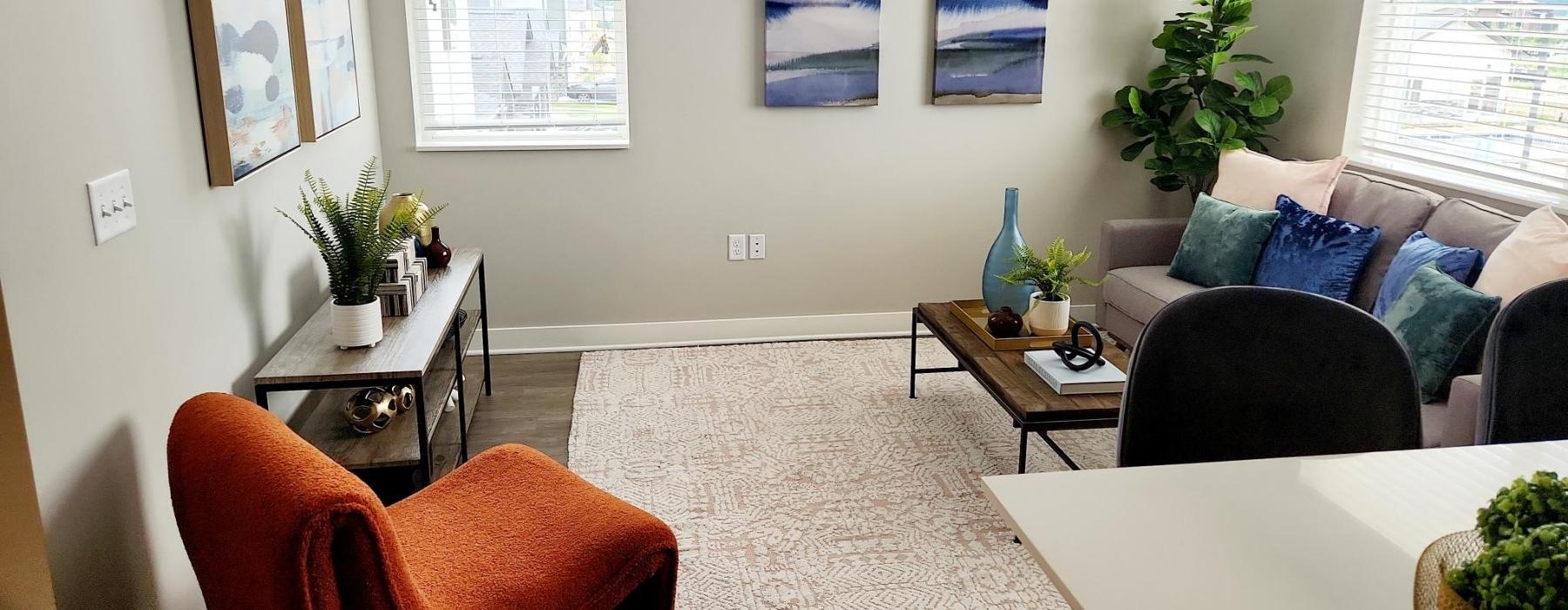 a living room with a couch and chairs